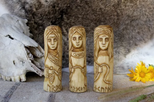 Small set of norse Norns. Urd, Verdandi, and Skuld. Wooden Norns statues