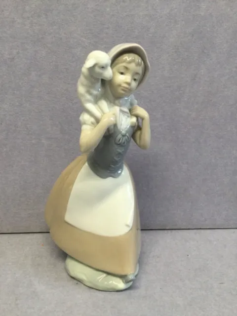 NAO by Lladro Good shepherdess girl carrying lamb 10” porcelain figurine T2447