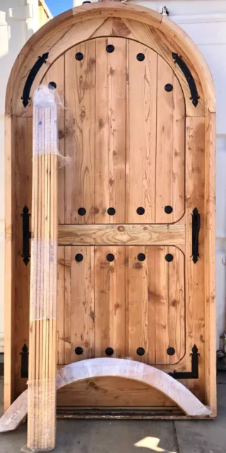 Rustic reclaimed lumber arched door solid wood storybook castle winery speakeasy