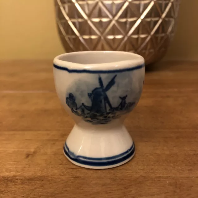 blue and white dutch egg cup with picture of windmill on.