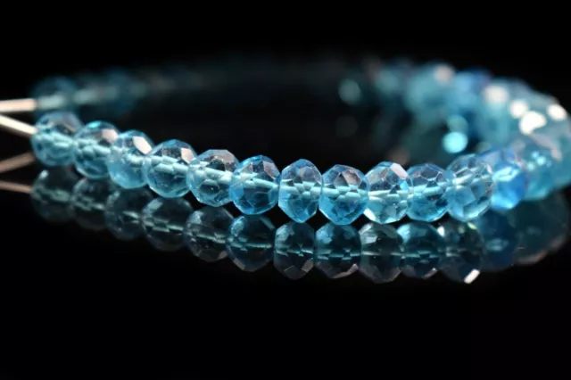 Belles perles de verre de forme de rondelle à facettes de topaze bleue...