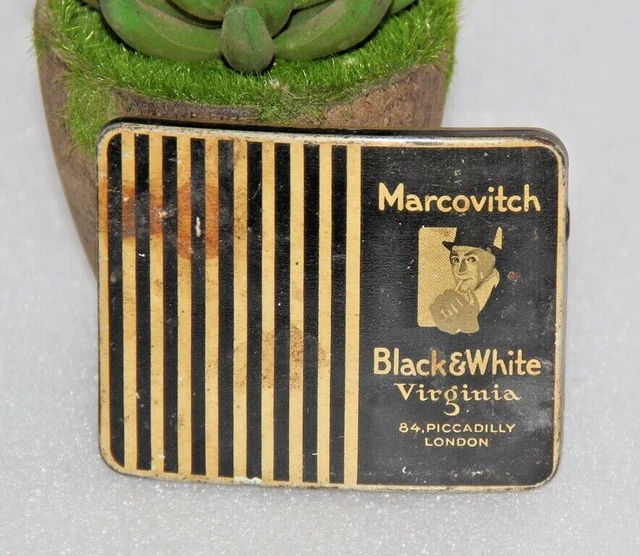 Caja de lata vacía de cigarrillos en blanco y negro de la marca Marcovitch...