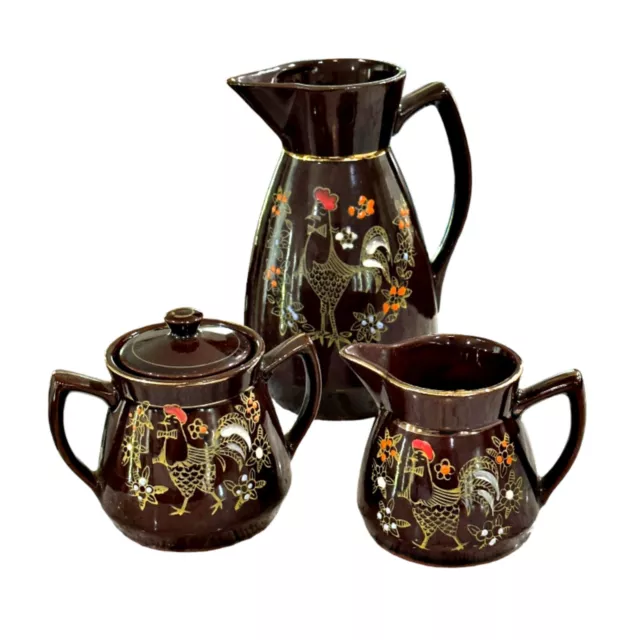 https://www.picclickimg.com/eFIAAOSw3R5kyuea/Vintage-Redware-Brown-Betty-Hand-Painted-Moriage-Roosters.webp