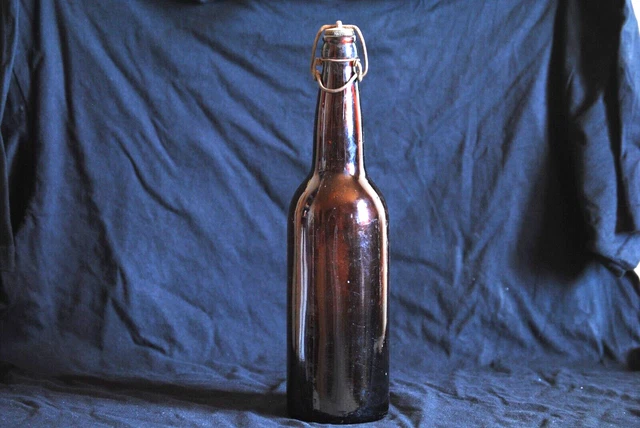 vintage antique brown glass bottle with resealable top