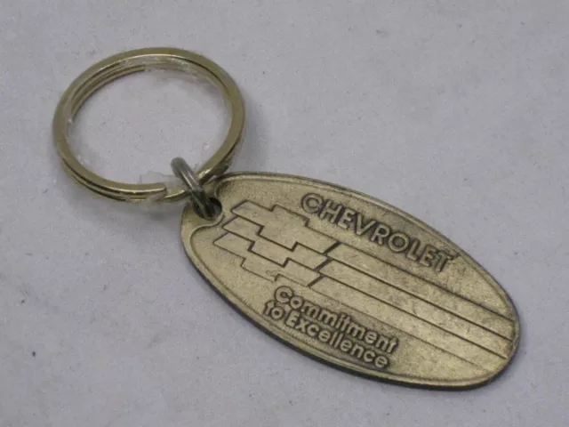 vintage CHEVROLET Commitment to Excellence key chain postage return fob tag