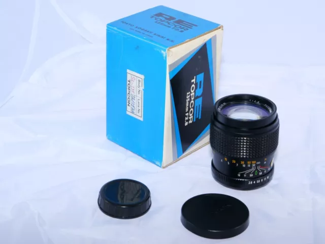 Topcon RE Topcor 135mmm f2.8 telephoto lens. Topcon Super Dm.  BOX.  AS-IS!