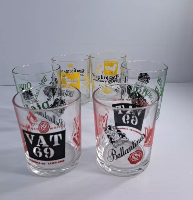 A Vintage Set of Ballantines Scotch Whiskey Longdrink Glasses Tumblers  golden Rim and Black Colored Coat of Arms and Titles 