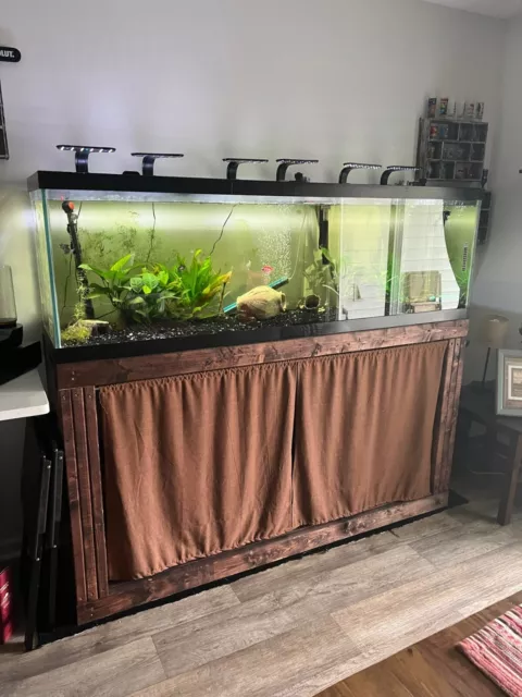 125-gallon fish tank aquarium. Includes lights, heater, filter, and stand.