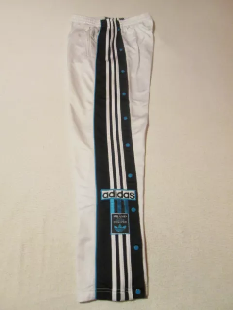 Pantalon adidas ouvert top sur le coté
