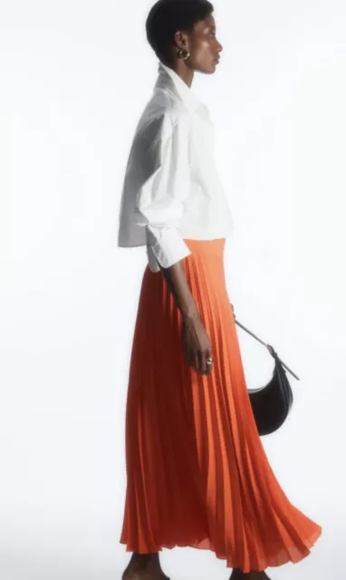 Orange pleated skirt uk top