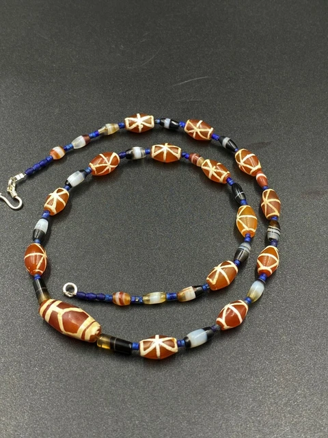 antique etch carnelian beads along with Indo Tibetan banded agate beads