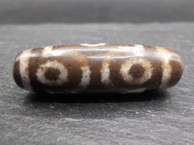 An Agate Dzi bead with a 6 Eye pattern from Tibet / Nepal.