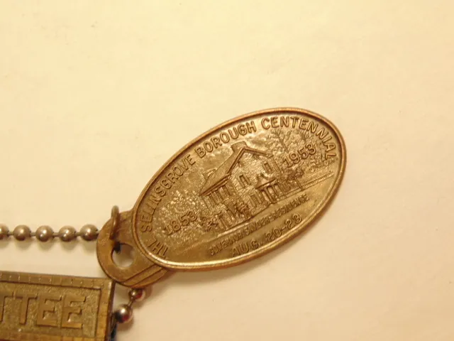 1953 Selinsgrove Borough Centennial brass colored keychain w/ patriotic ribbon