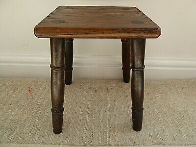 Vintage solid oak milking stool, 4 turned legs, carved edge to seat 7