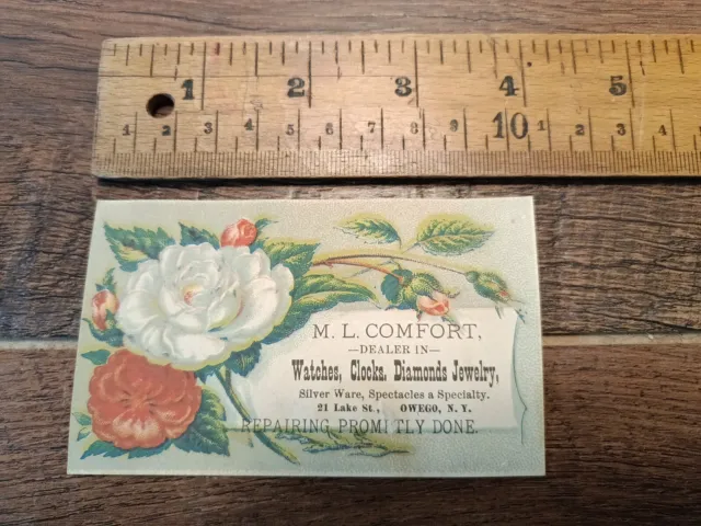 1880s trade card. M.L. Comfort, Watches, Jewelry Etc. Owego, N.Y.   Flowers (M1)