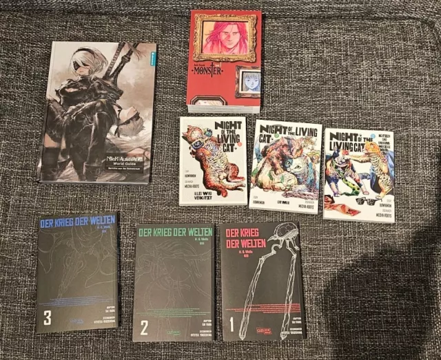 Verschiedene Mangas und Nier Automata World Guide