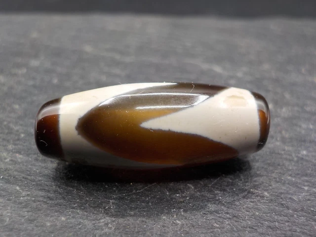 An Agate Dzi bead with a Tiger Tooth pattern from Tibet / Nepal.