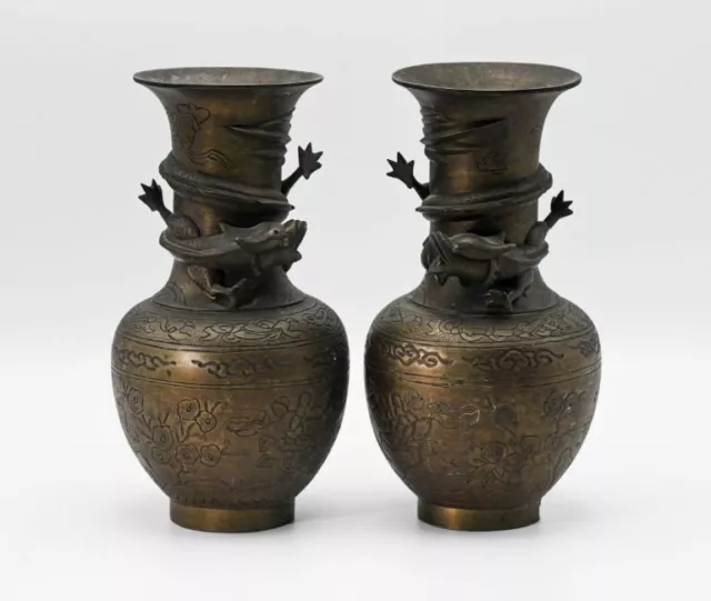 Pair of Chinese bronzed vases, height 24cm with dragon decoration in relief.