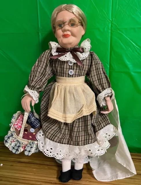 Grandma Porcelain doll with Sewing items in basket