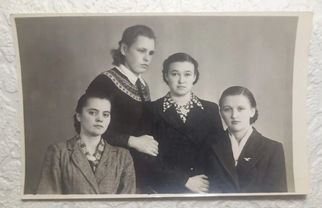 Vintage Photo. Four girls in tuxedos pose for a portrait.