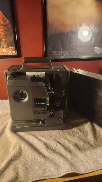 VINTAGE Bell & Howell  16mm Film Projector. Model 2585. Powers on, light works.