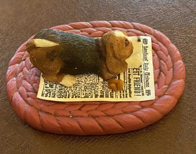 sandcast vintage beagle Puppy on newspaper and a mat