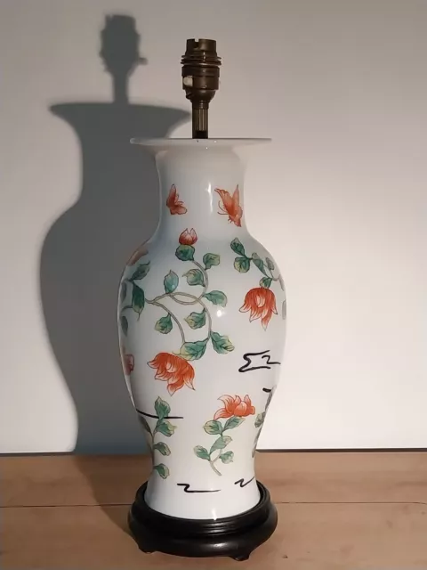 Lovely old white porcelain Chinese lamp hand decorated with a floral design