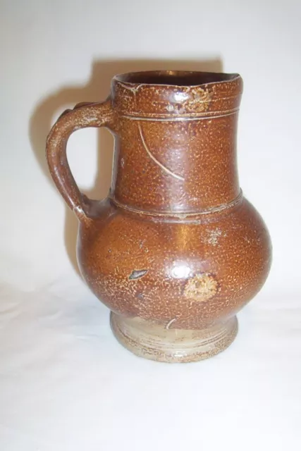 Raeren stoneware drinking mug c. 16th century.     Bellarmine krug