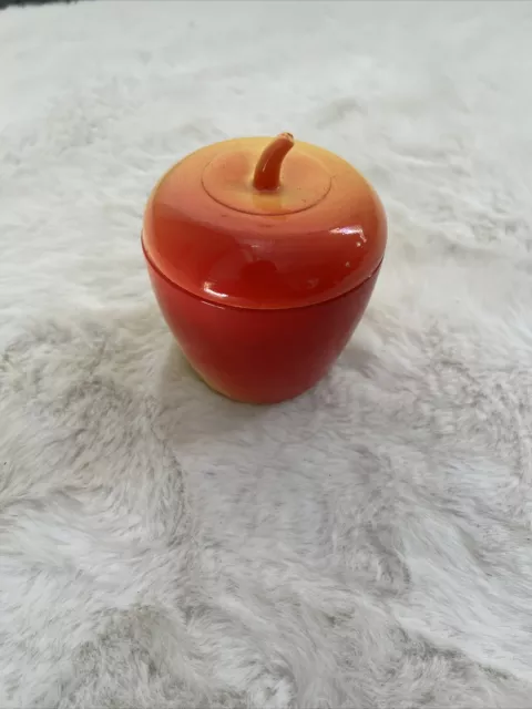 Red and yellow milk glass apple jar