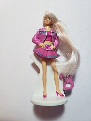 Barbie in cute pink jacket & skirt on a white stand - Vtg