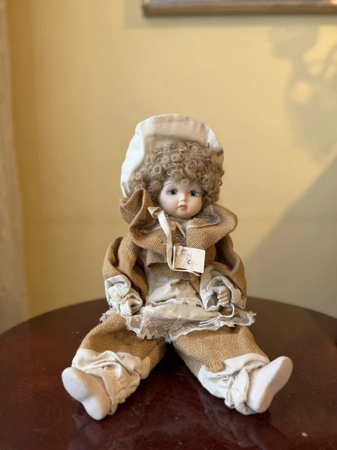 Petite poupée ancienne, 11 articulations, tête porcelaine