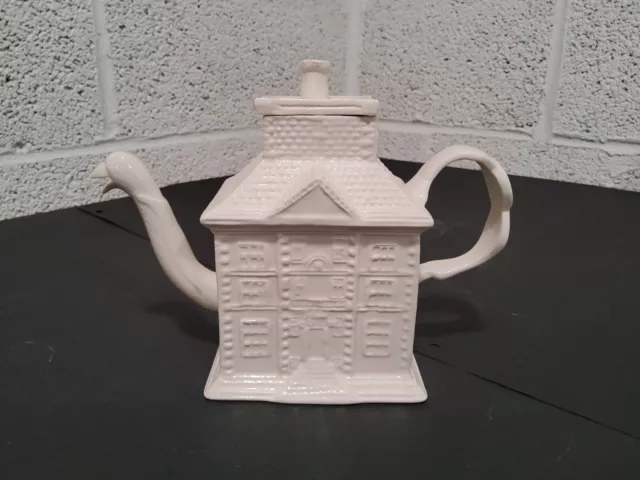 Mma English Staffordshire White Salt-Glazed House Form Teapot.          78B