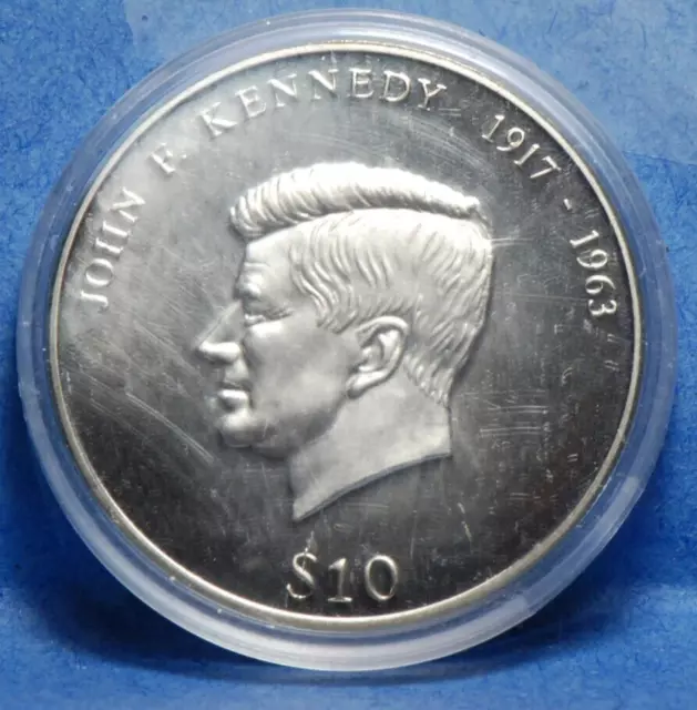 Liberia 2000 10 Dollars, J.F. Kennedy UNC, marks on capsule not coin Proof? 3-25