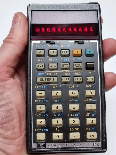 Hewlett-Packard scientific programmable calculator HP-34C with pouch & papers