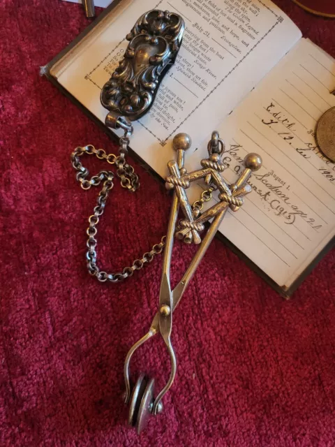 Victorian Fyfes Patent "Lucky talisman" skirt lifter belt clip and chain.