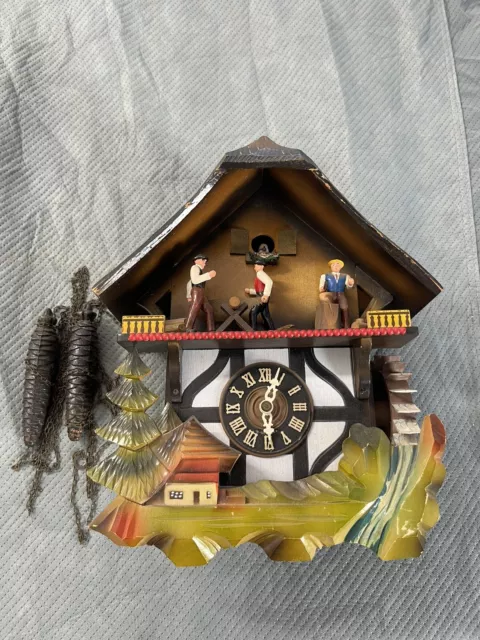 Vintage Black Forest GERMAN MUSICAL  Cuckoo Clock w Men Chopping. Sawing