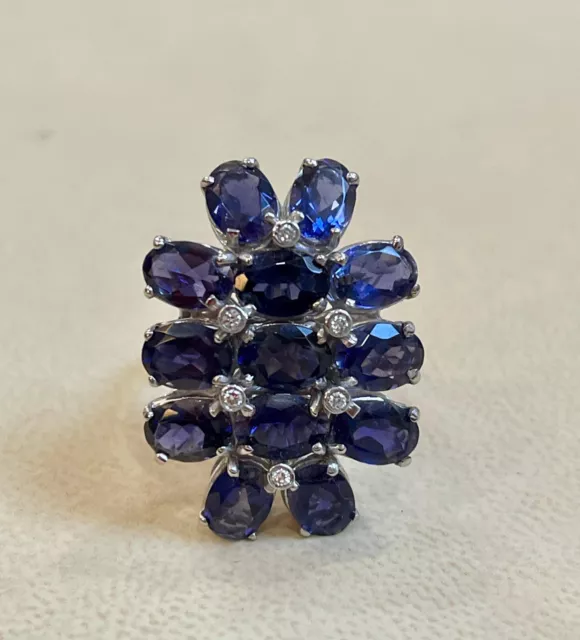 Features Royal Blue Oval Cut 10.14CT Sapphires & Lab-Created Diamond Flower Ring