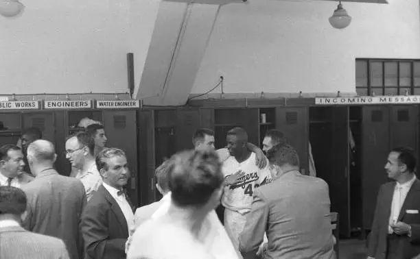 Brooklyn Dodgers Jackie Robinson posing for photograph with teamma - Old Photo