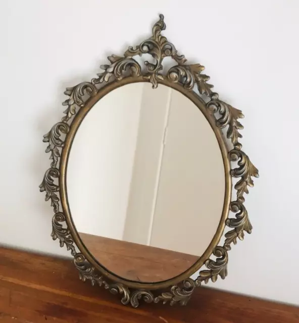 Vintage ornate brass oval wall mirror.40.5 x 31 cm.