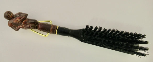 Vintage wood clothes brush featuring carved football Quarterback
