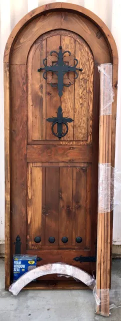 Rustic castle reclaimed lumber arched old growth Doug Fir solid door winery