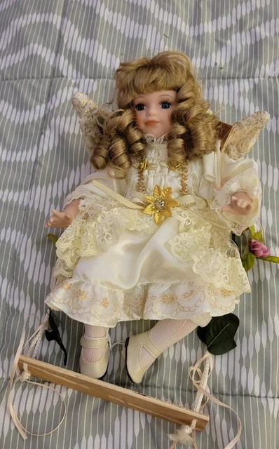Emerald Doll Collection Vintage Porcelain Angel Doll on Wooden Swing  70189