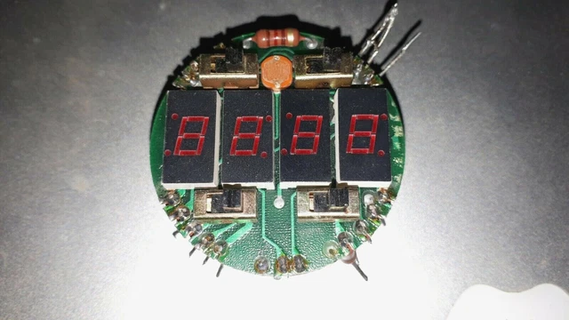 Four MAN74A 7-SEGMENT LED displays on circuit board with switches CIRCA 1978