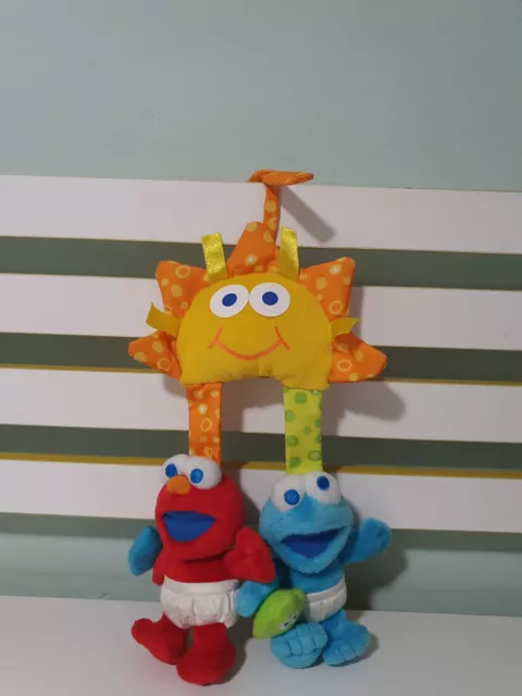 Sesame Beginnings Baby Elmo And Cookie Monster Attached To A Sun