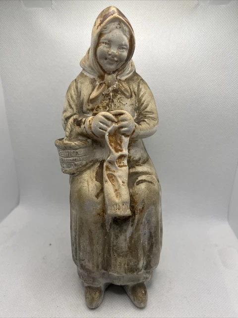 Gorgeous vintage coin collector/piggy bank of an Older woman knitting.