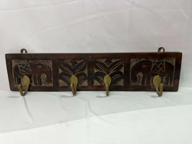 Wooden Cloth or key hanger. Hand Carved with 4 Stylish metal hooks.