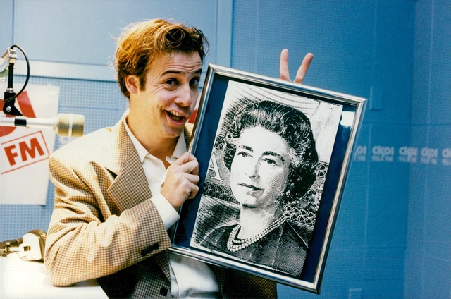 Pierre Brassard posed with a portrait of Queen... - Vintage Photograph 961677