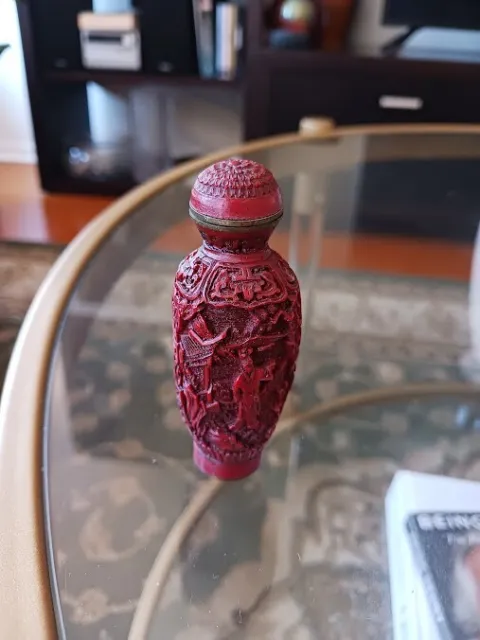 Chinese Red Cinnabar Antique Snuff Bottle with lid and stopper. signed. lovely