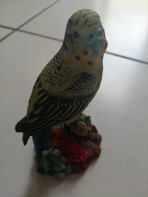 Green / yellow budgerigar ceramic ornament. Sat on branch very colourful