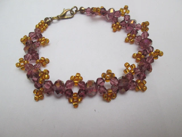 Bracelet With Orange  And Purple Coloured Beads.